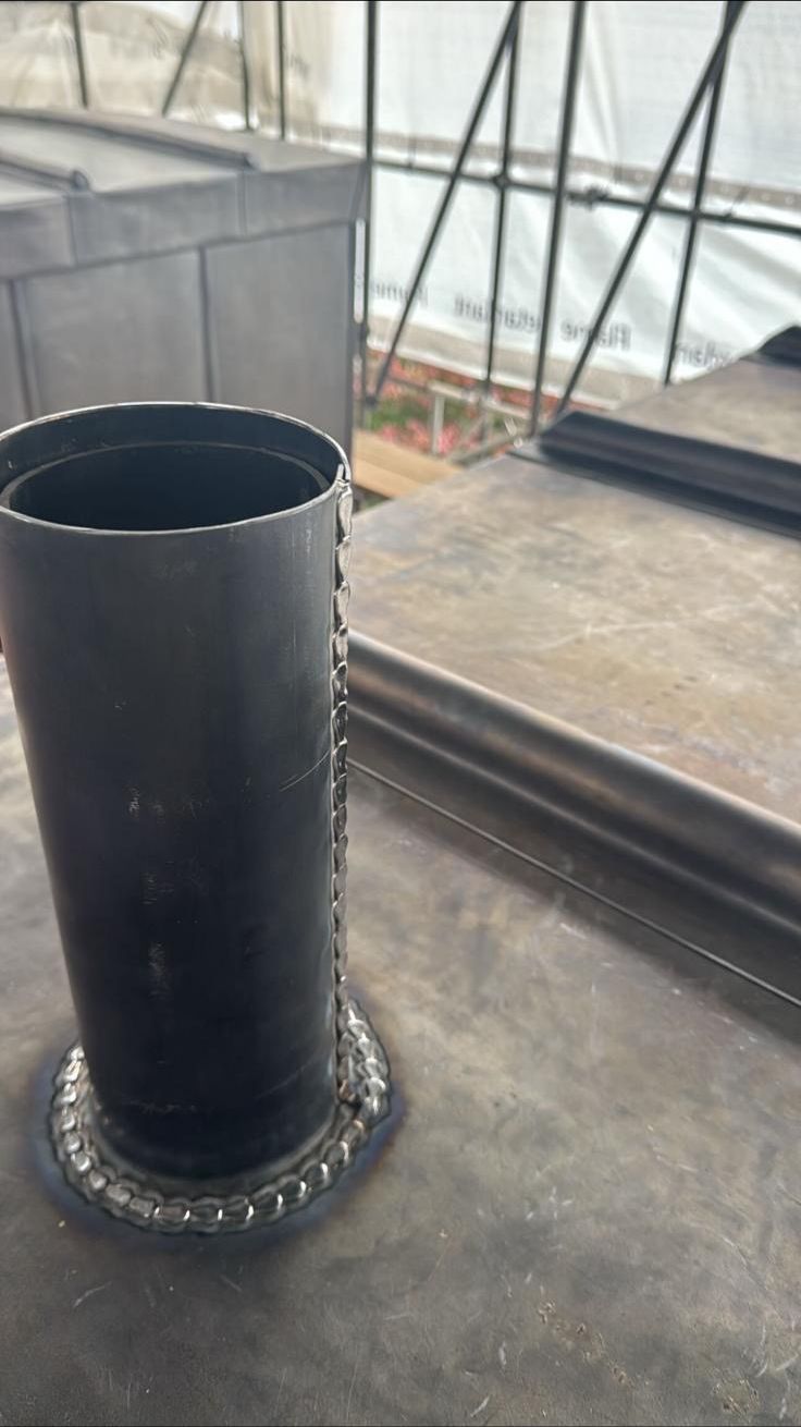 Lead pipe collar, welded by hand on site